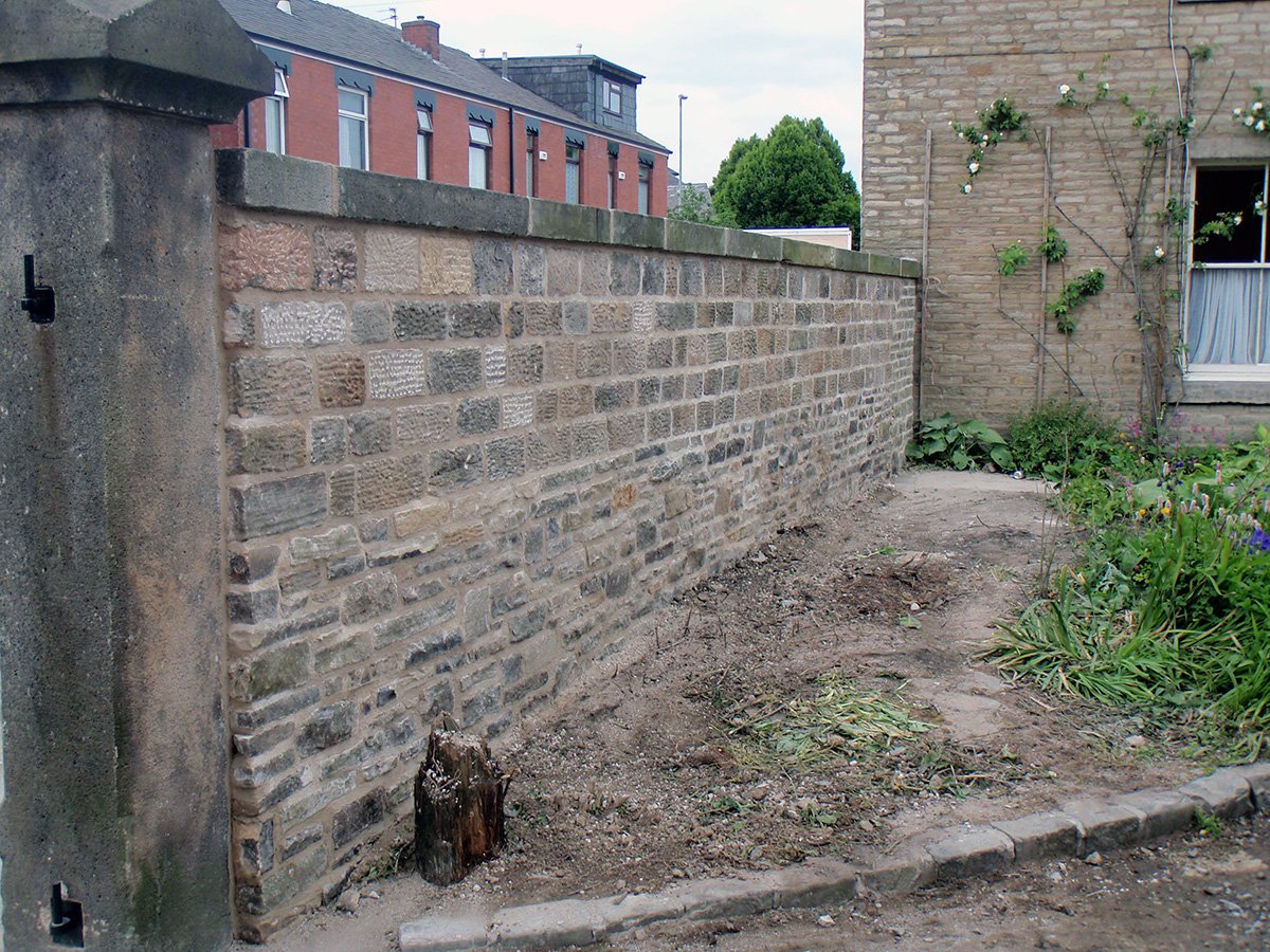 Rebuilding Stone Wall - UK Restoration Services