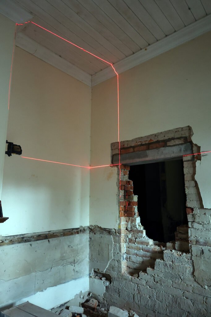 A laser measuring the door frame